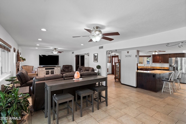 10532 W Catalina Dr, Avondale, AZ 85392 - living area featuring ceiling fan and recessed lighting