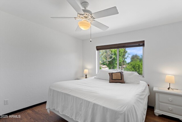 10532 W Catalina Dr, Avondale, AZ 85392 - bedroom with dark wood-type flooring, a ceiling fan, and baseboards