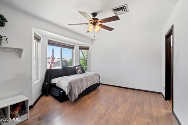 10532 W Catalina Dr, Avondale, AZ 85392 - bedroom featuring wood finished floors, baseboards, and ceiling fan
