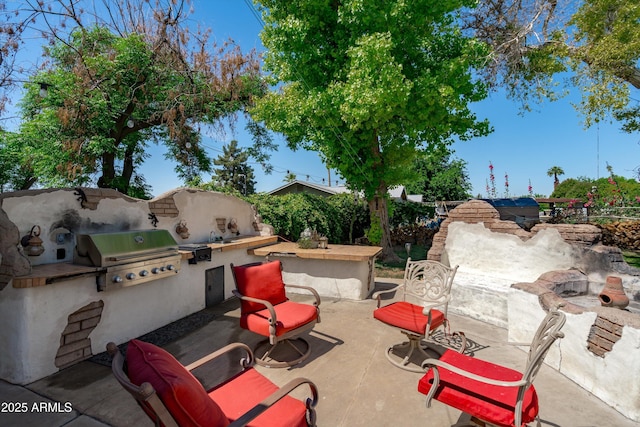 10532 W Catalina Dr, Avondale, AZ 85392 - view of patio / terrace featuring a grill and an outdoor kitchen