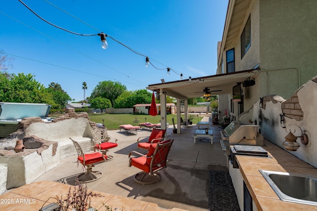 10532 W Catalina Dr, Avondale, AZ 85392 - view of patio / terrace with area for grilling, a ceiling fan, and a sink