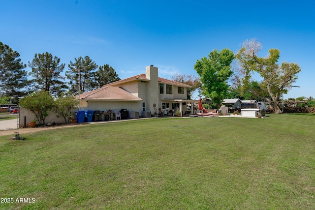 10532 W Catalina Dr, Avondale, AZ 85392 - back of house featuring a chimney, stucco siding, cooling unit, and a tiled roof