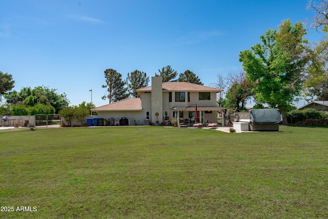 10532 W Catalina Dr, Avondale, AZ 85392 - rear view of property with a hot tub, a chimney, stucco siding, and a patio