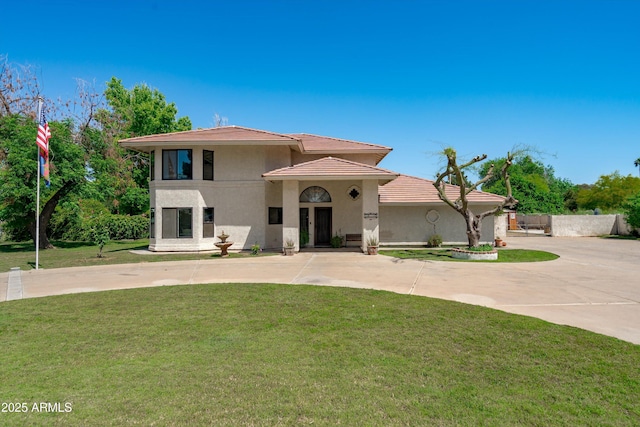 10532 W Catalina Dr, Avondale, AZ 85392 - view of front of home featuring stucco siding, a front lawn, curved driveway, and a tile roof