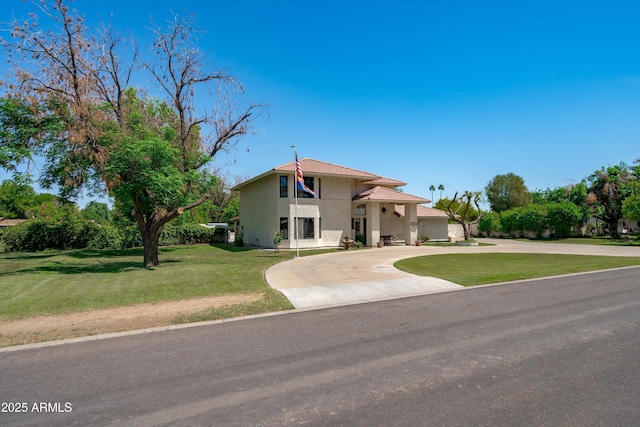 10532 W Catalina Dr, Avondale, AZ 85392 - view of front facade with curved driveway, a front lawn, and stucco siding