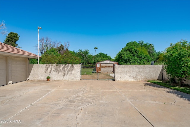 10532 W Catalina Dr, Avondale, AZ 85392 - view of patio / terrace with a gate, fence, and concrete driveway