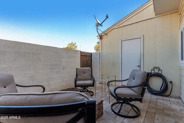 view of patio featuring fence