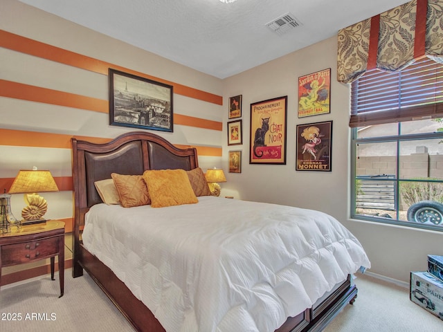 bedroom featuring visible vents, baseboards, and carpet floors