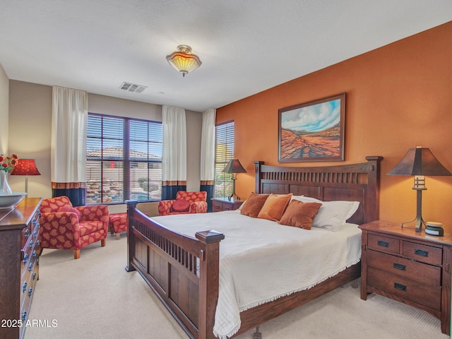 bedroom featuring carpet flooring and visible vents