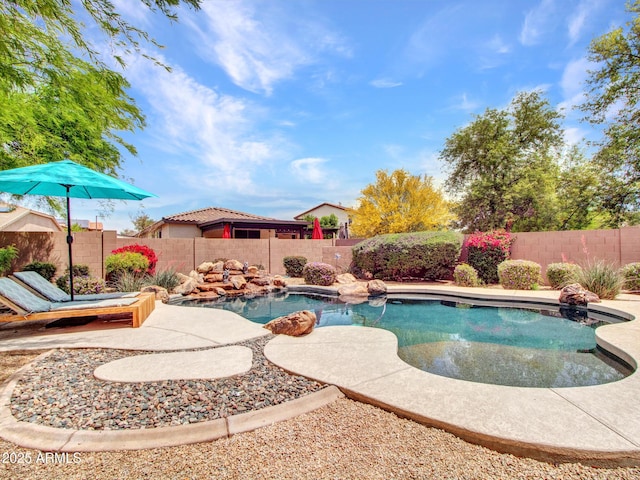 view of swimming pool featuring a fenced in pool and a fenced backyard