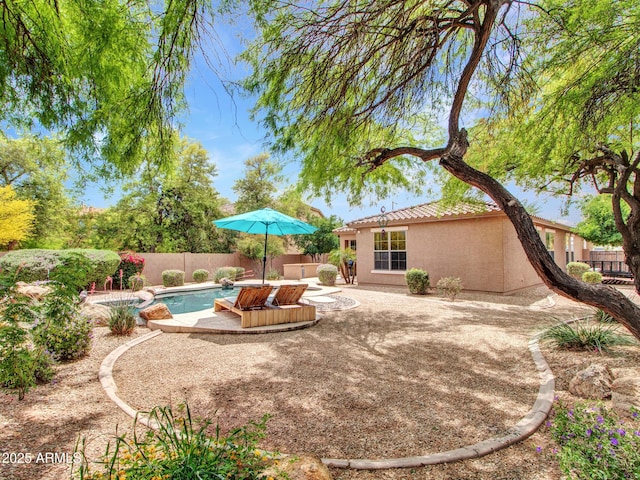 exterior space with a fenced backyard, a patio area, and a fenced in pool