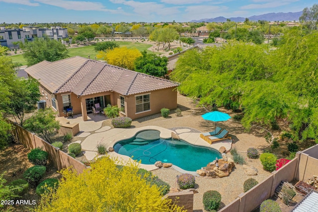 view of pool featuring a fenced backyard, a patio, a fenced in pool, and central AC unit