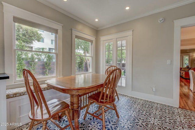 dining area with light tile patterned flooring, recessed lighting, crown molding, and baseboards