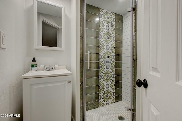 full bathroom with vanity and a shower stall