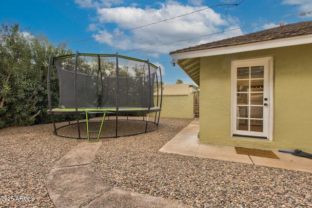 view of yard featuring a trampoline