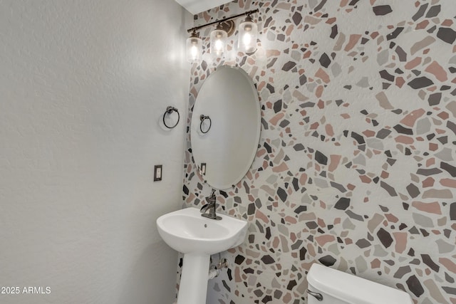 bathroom featuring toilet