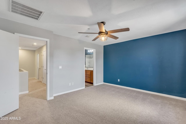 unfurnished bedroom featuring carpet floors, a ceiling fan, baseboards, and visible vents