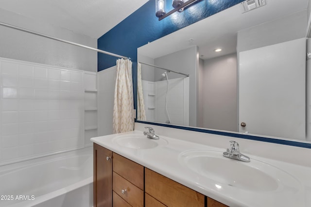 bathroom with double vanity, shower / bath combo with shower curtain, visible vents, and a sink