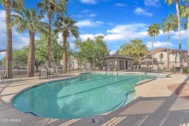 pool featuring a patio and fence