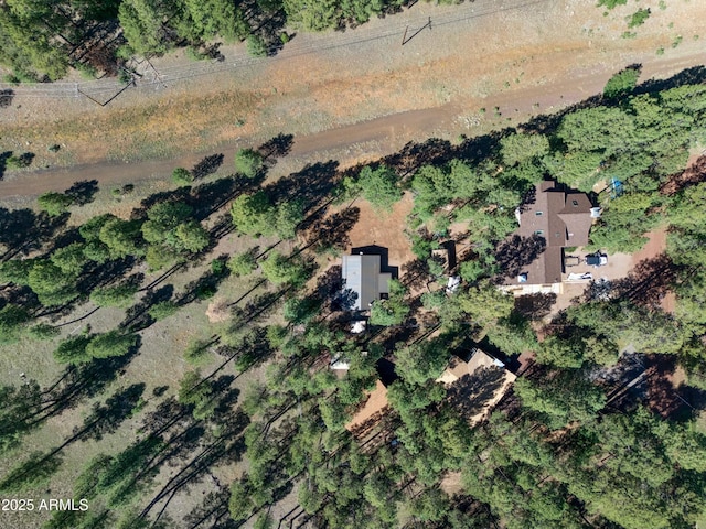 birds eye view of property featuring a rural view