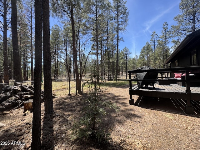 view of yard with a wooden deck