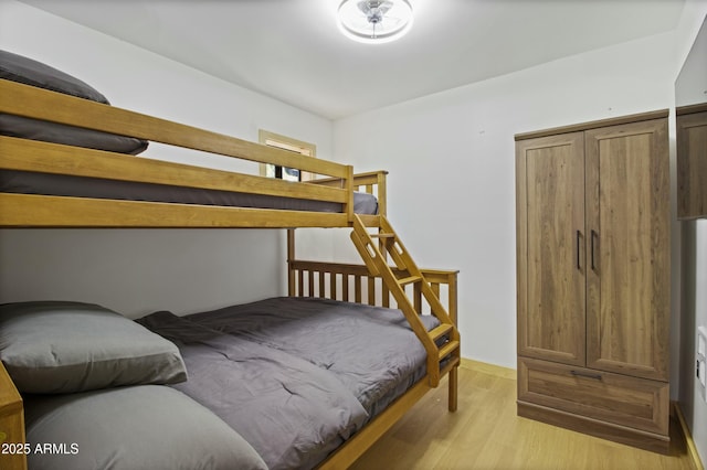 bedroom featuring light wood finished floors