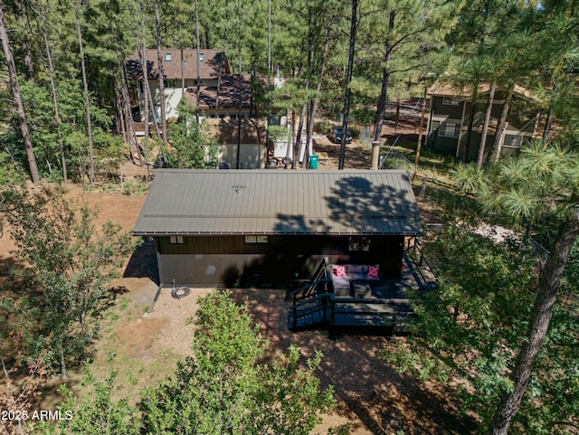 aerial view featuring a wooded view