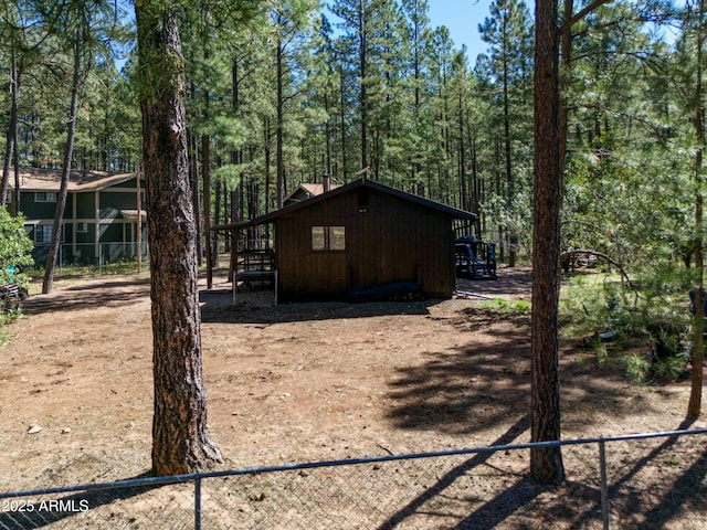 view of home's exterior featuring fence