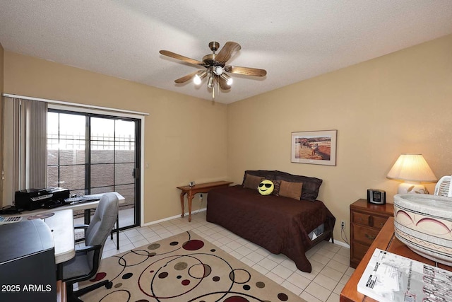 tiled bedroom with ceiling fan, a textured ceiling, and access to outside