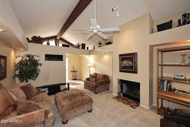 living room with beamed ceiling, light carpet, and a textured ceiling