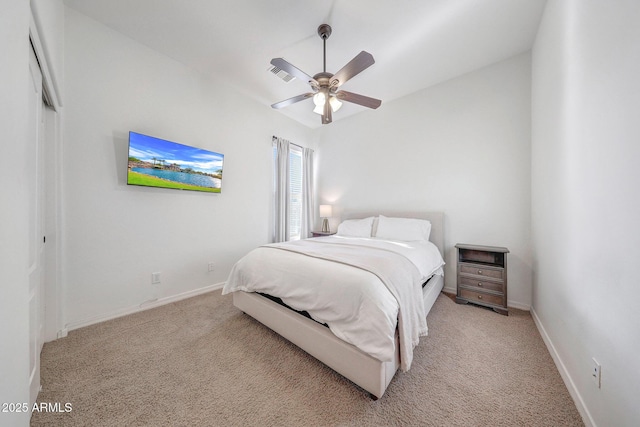 bedroom with light colored carpet, baseboards, visible vents, and ceiling fan