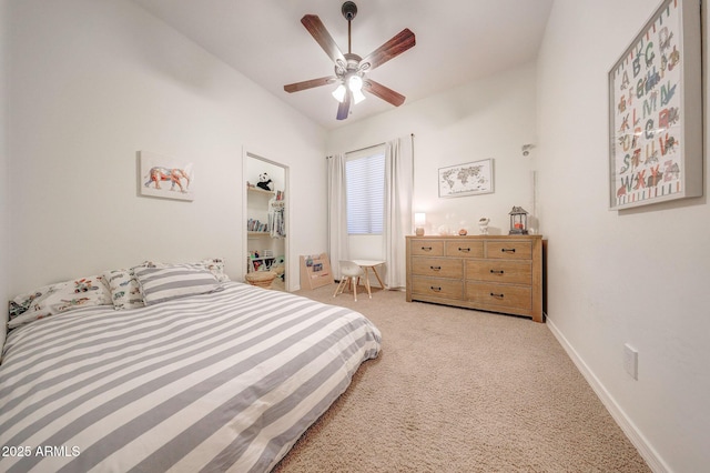 bedroom with baseboards, carpet flooring, a ceiling fan, and lofted ceiling