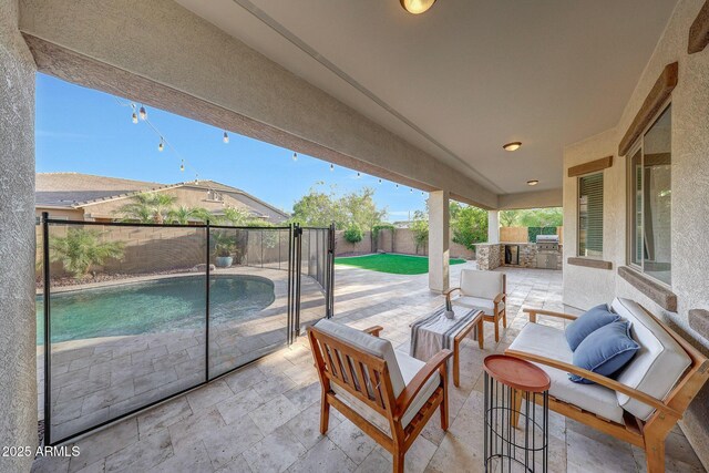view of patio / terrace with area for grilling, a fenced in pool, a fenced backyard, and an outdoor hangout area