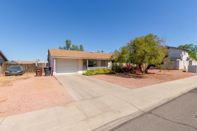 ranch-style home featuring a garage