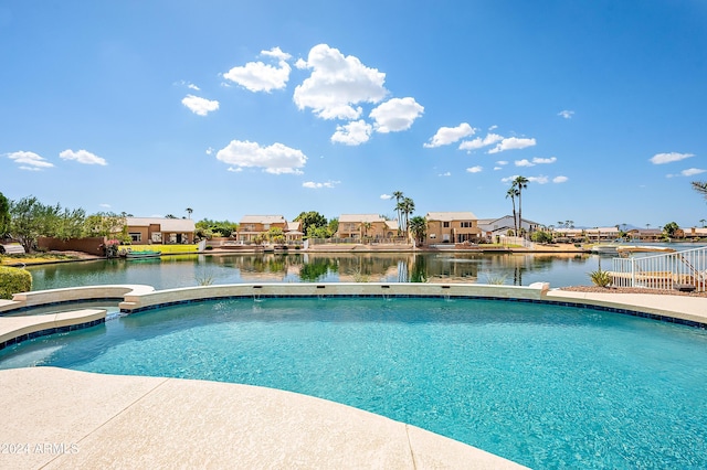 view of pool with a water view