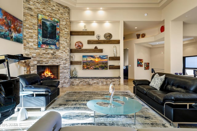 living room featuring a stone fireplace