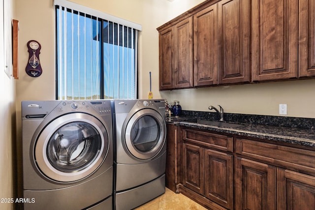 clothes washing area with light tile patterned floors, cabinet space, a sink, and separate washer and dryer