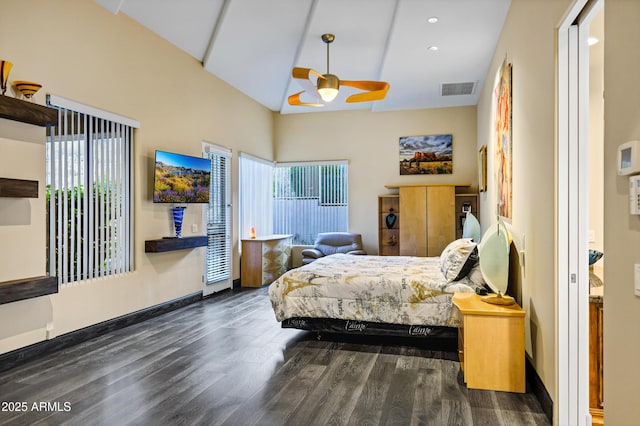 bedroom featuring vaulted ceiling, wood finished floors, visible vents, and baseboards