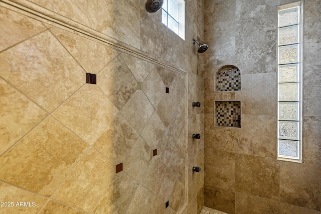 bathroom with tiled shower