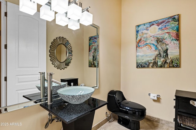 half bathroom featuring tile patterned flooring and toilet