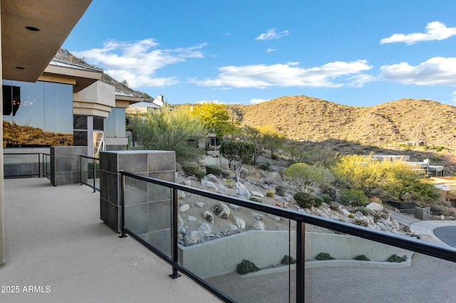 balcony featuring a mountain view