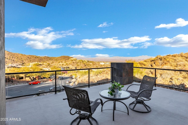 balcony featuring a mountain view