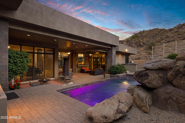 view of swimming pool featuring a fenced in pool, a patio area, and outdoor lounge area