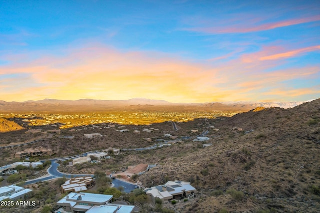 birds eye view of property featuring a mountain view