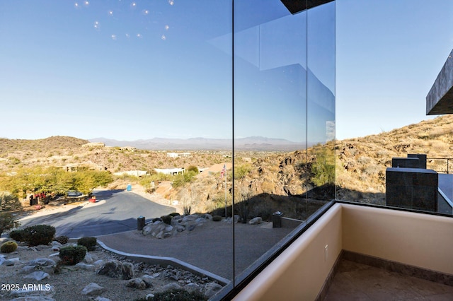 balcony featuring a mountain view