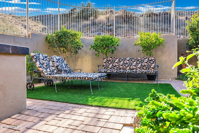 view of yard with fence and a patio