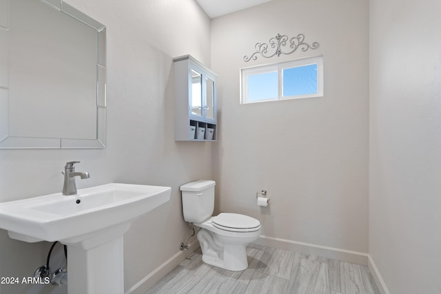 bathroom with sink and toilet