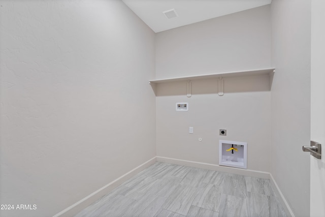 clothes washing area featuring electric dryer hookup, hookup for a gas dryer, and hookup for a washing machine