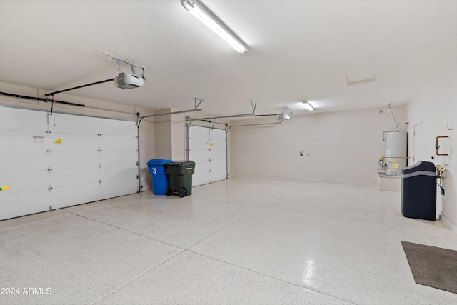 garage featuring a garage door opener and gas water heater