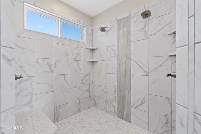 bathroom featuring a tile shower